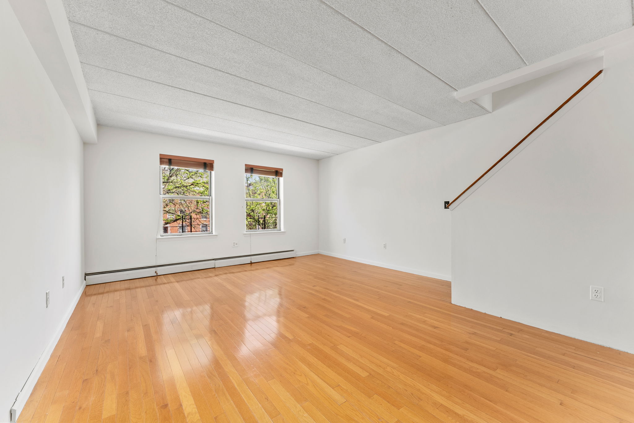 2573 Frederick Douglass Boulevard, Unit D Manhattan, NY 10030 - Photo 2 of 13 an empty room with windows