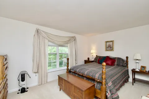 a bathroom with a sink a toilet and shower curtain