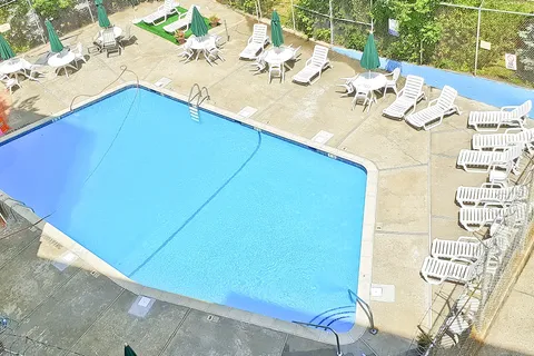 a terrace with a table and chairs