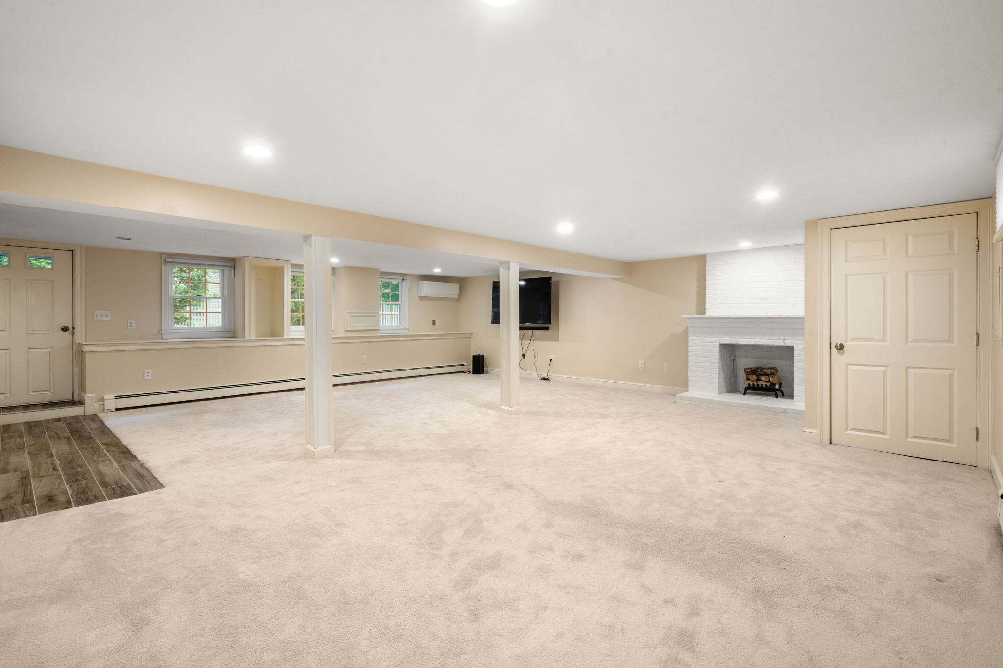 4 Gage Road Wayland, MA 01778 - Photo 22 of 32 a view of empty room with wooden floor and fireplace