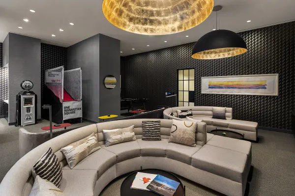 a bedroom with a bed window and couch