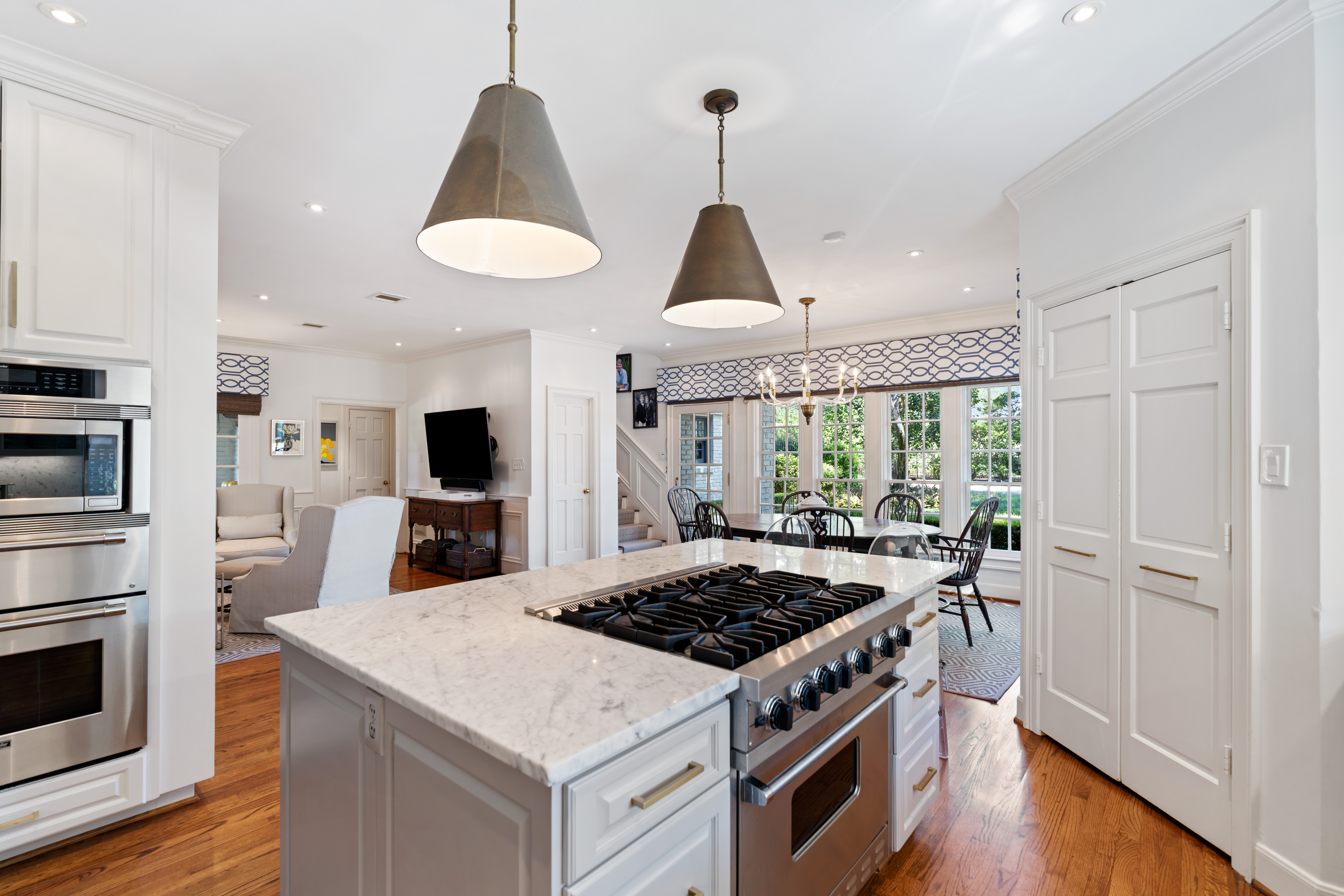 711 Pifer Road Houston, TX 77024 - Photo 19 of 53 a kitchen with a stove and a view of living room