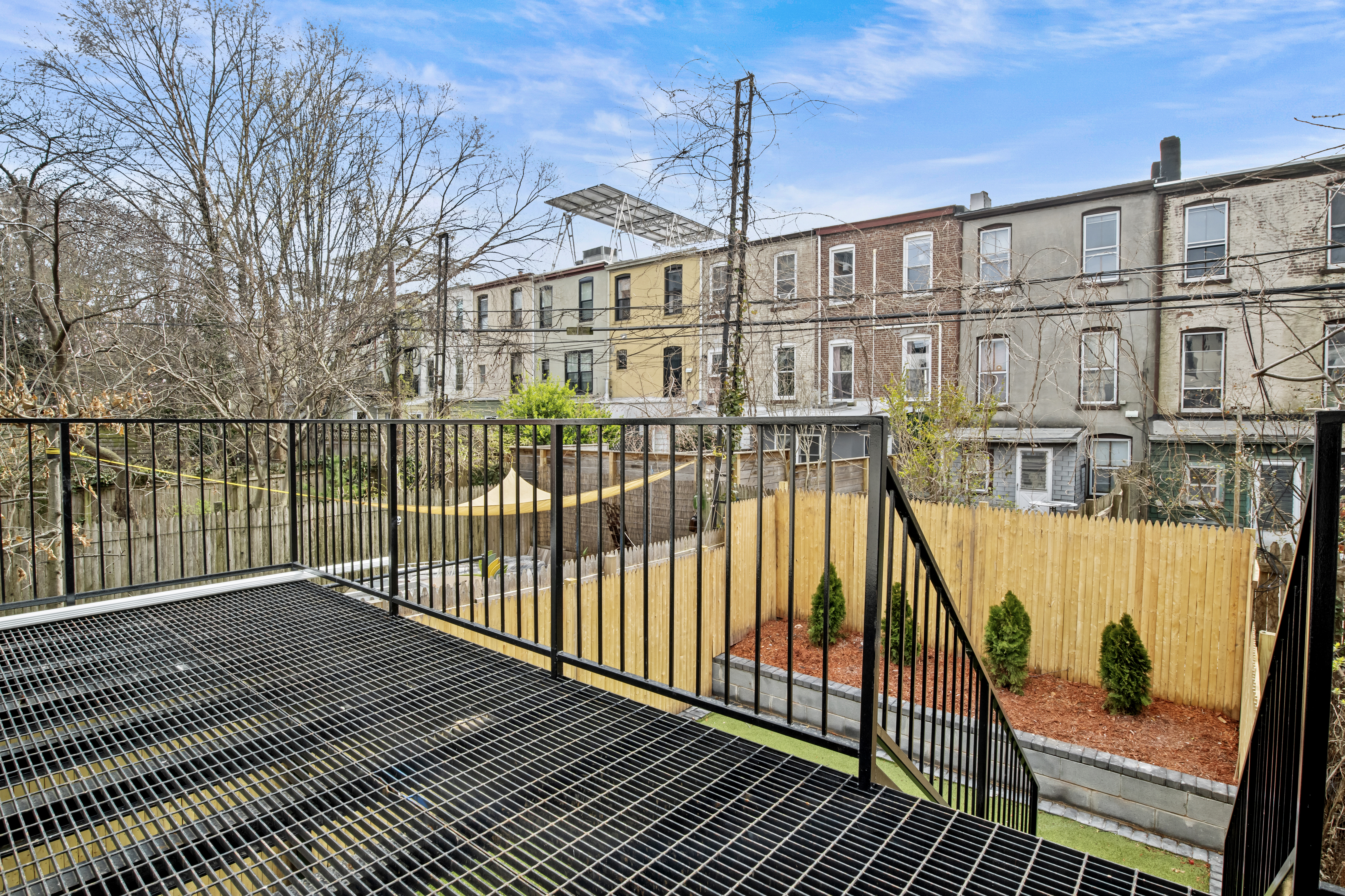 320 10th Street Brooklyn, NY 11215 - Photo 21 of 27 a view of a balcony with wooden floor and fence