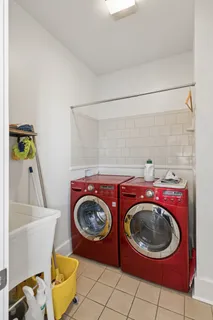 a bathroom with a toilet a sink a mirror and vanity