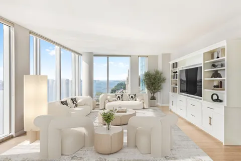 a living room with furniture a flat screen tv and a large window