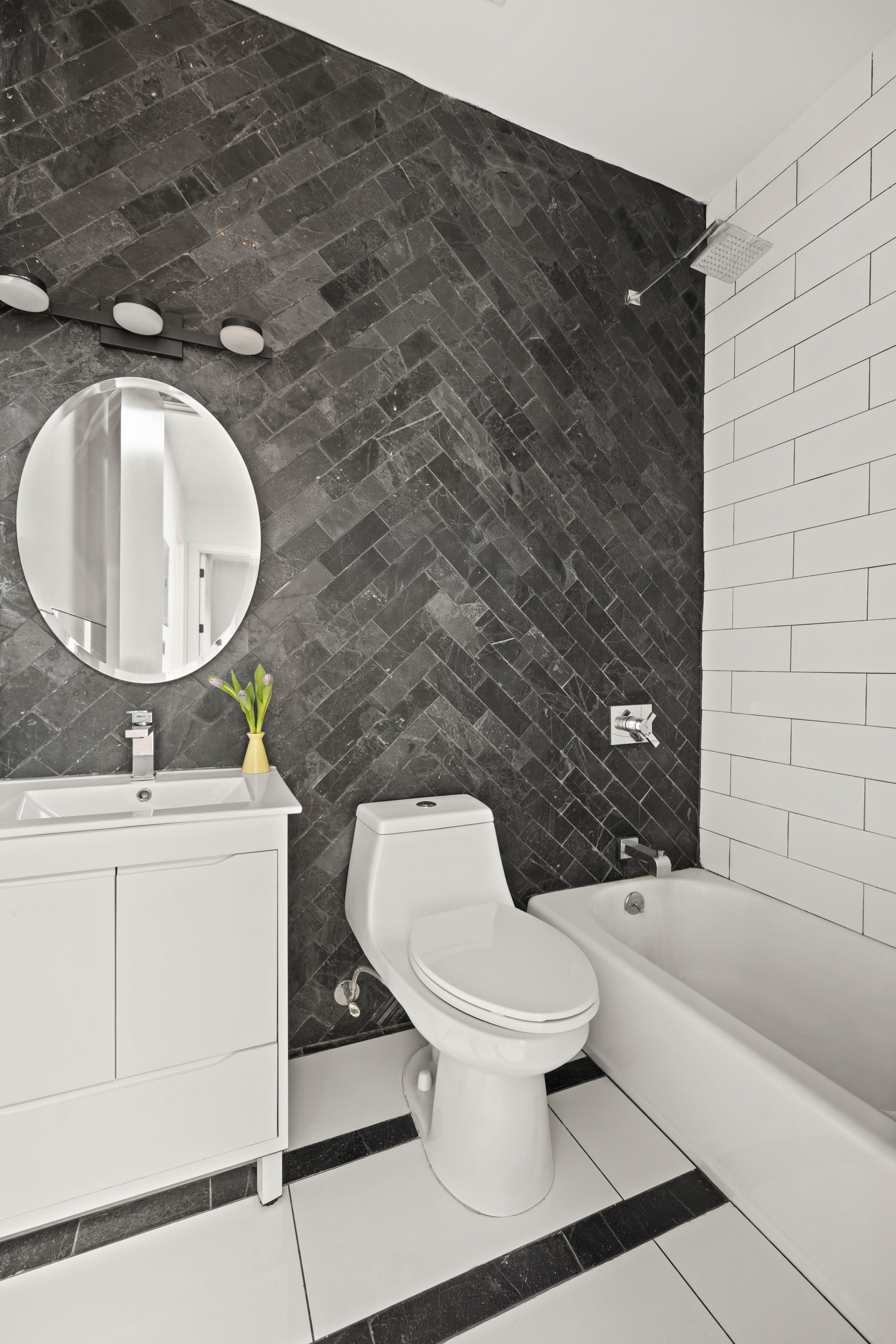 750 Lincoln Place Brooklyn, NY 11216 - Photo 17 of 24 a bathroom with a toilet sink and mirror