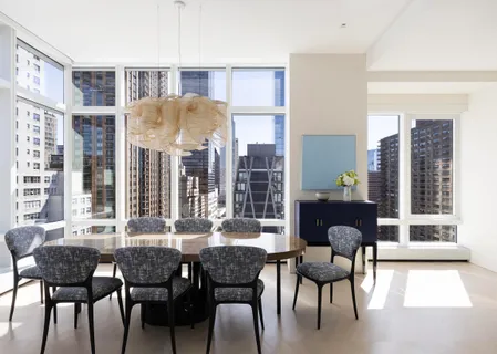 a dining room with furniture and window