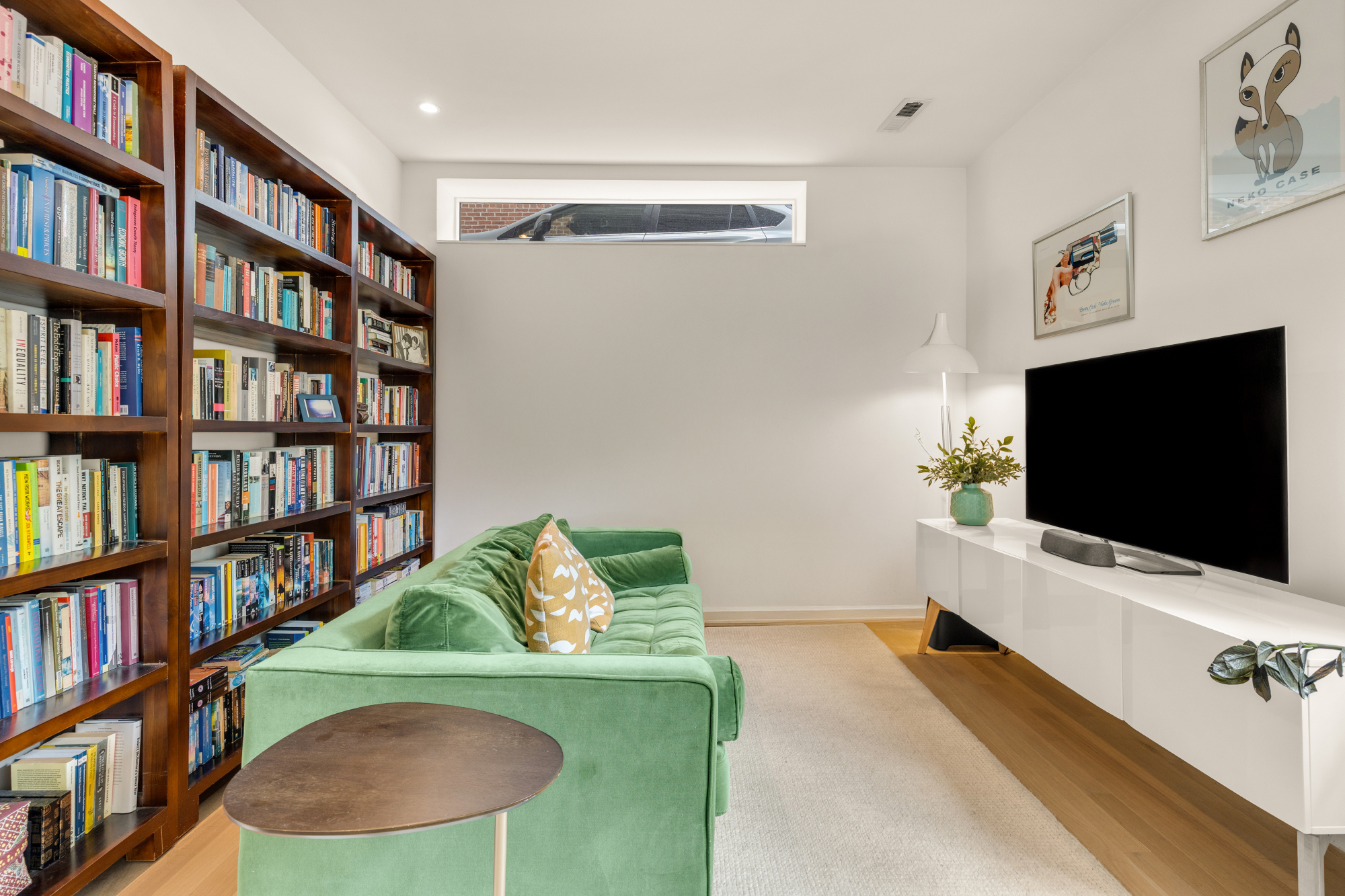 1501 4th Street Northwest, Unit 1 Washington, DC 20001 - Photo 36 of 41 a living room with furniture and a flat screen tv