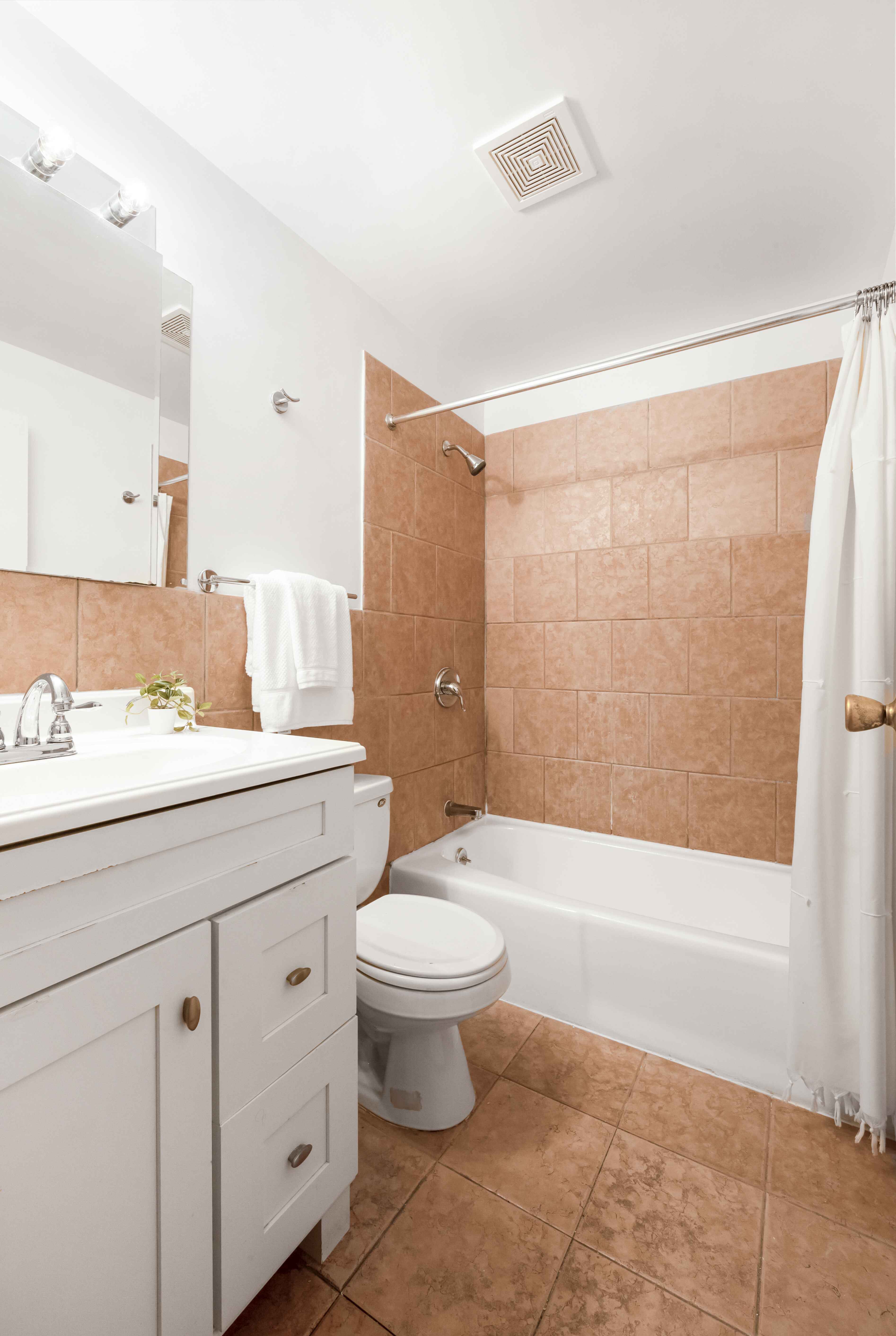 420 6th Avenue, Unit 11 Brooklyn, NY 11215 - Photo 4 of 10 a bathroom with a sink a toilet and bathtub