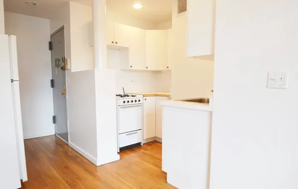 a view of walk in closet with white walls