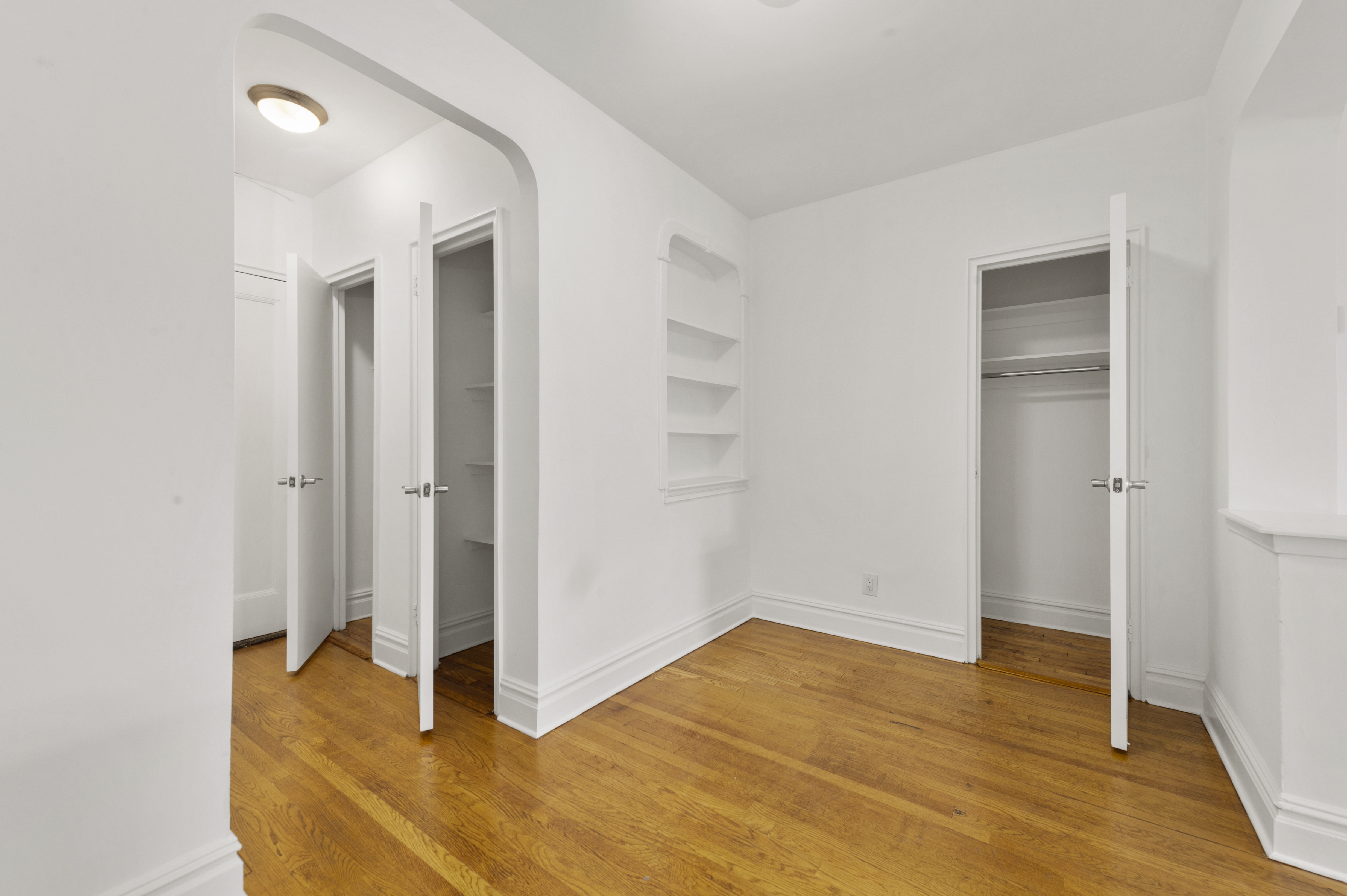 105-05 69th Avenue, Unit 301 Queens, NY 11375 - Photo 9 of 13 a view of empty room with wooden floor