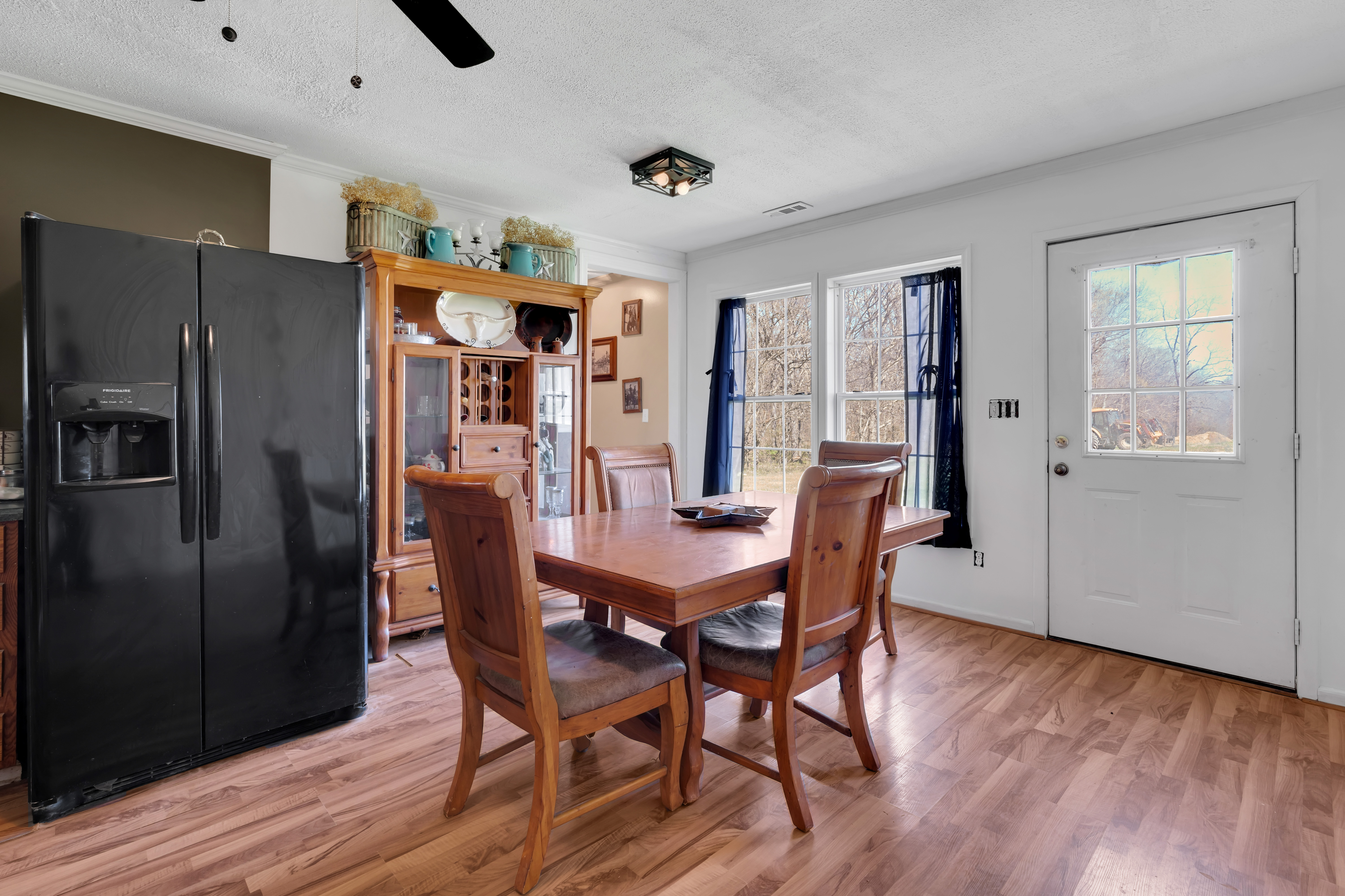 2073 Harpo Road Manchester, TN 37355 - Photo 33 of 45 a dining room with furniture a window and wooden floor