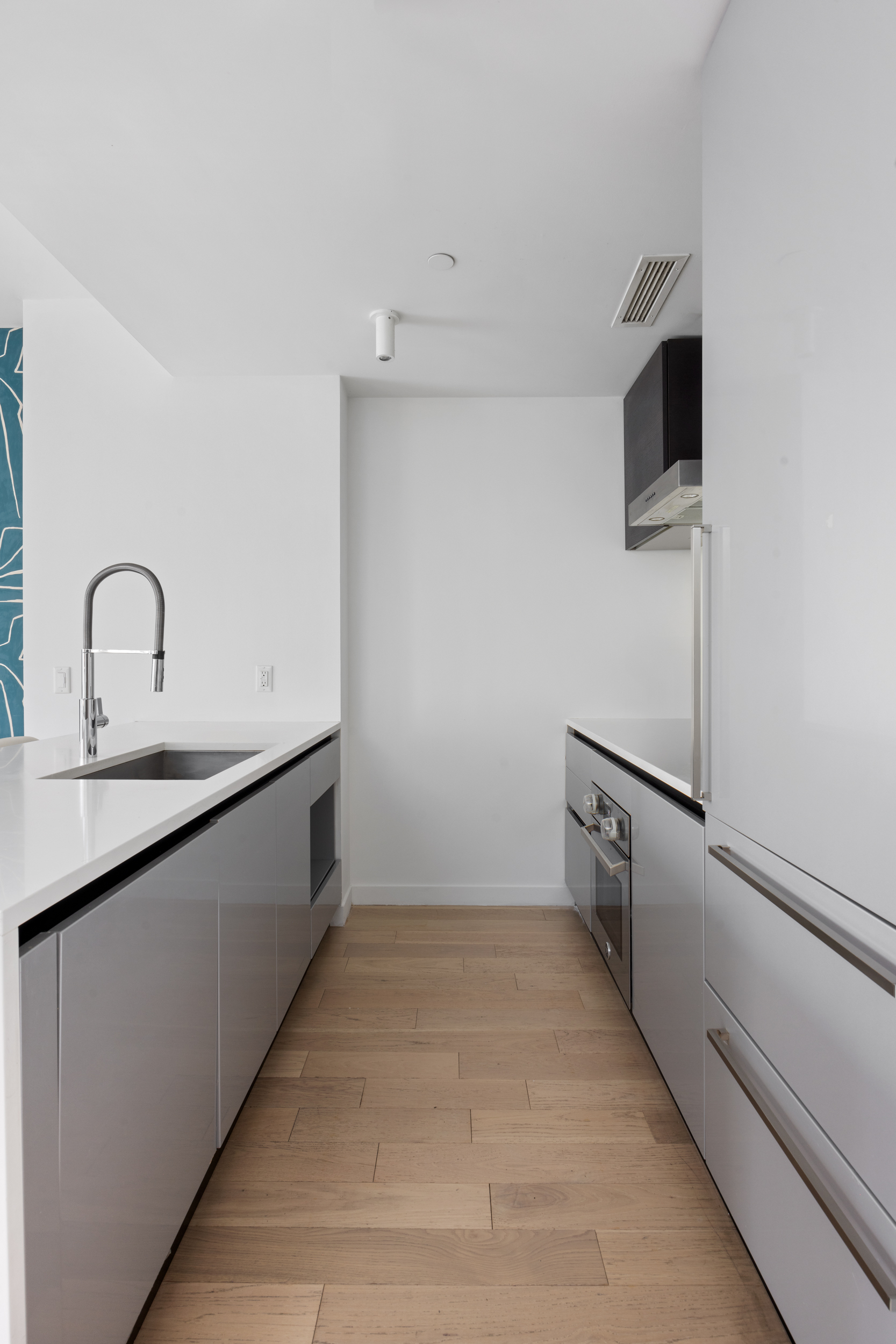 540 West 49th Street, Unit PH1N Manhattan, NY 10019 - Photo 6 of 18 a view of a kitchen with a sink dryer and a window