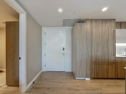 a view of a dining room with furniture and a flat screen tv