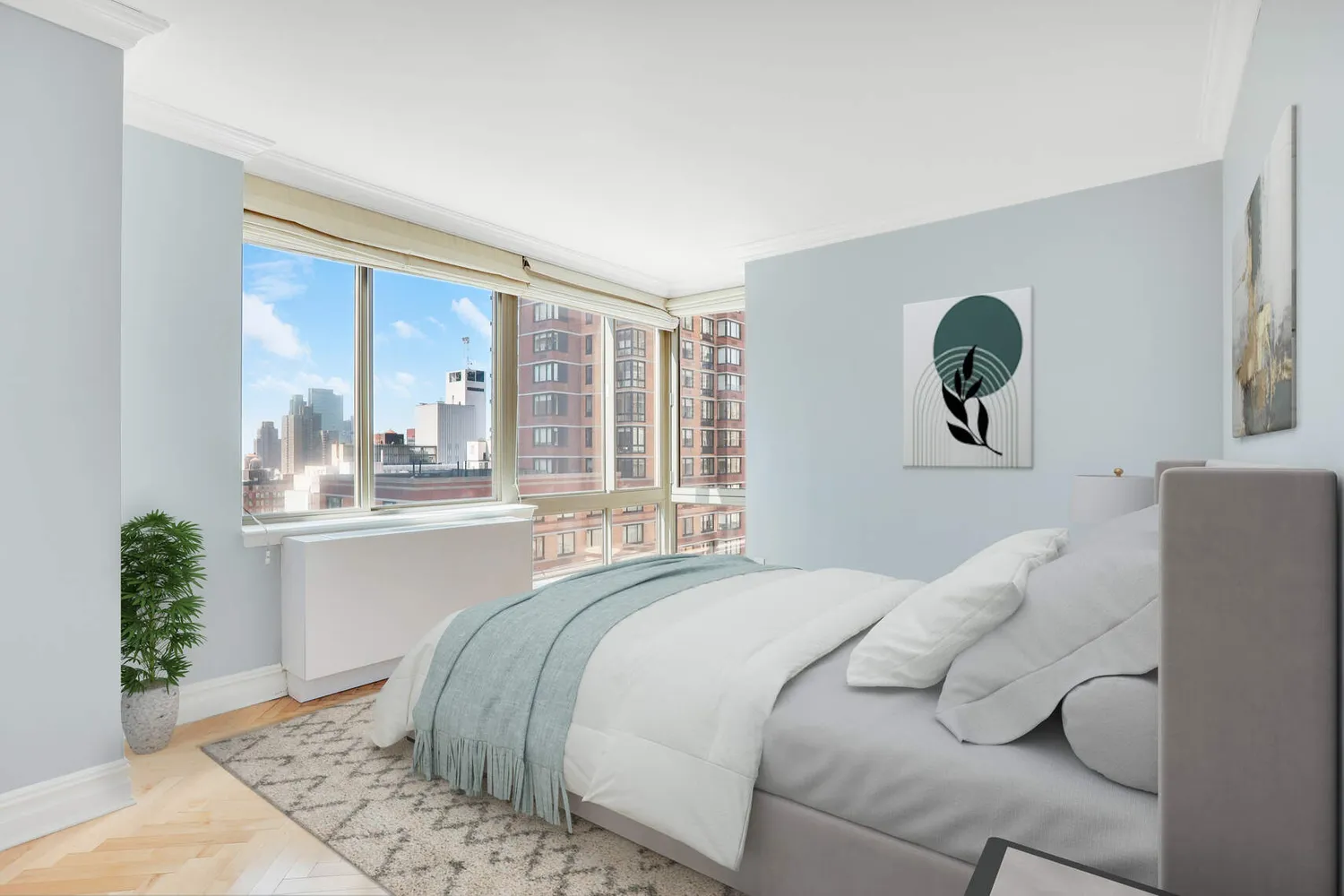 a bed sitting in a bedroom next to a window