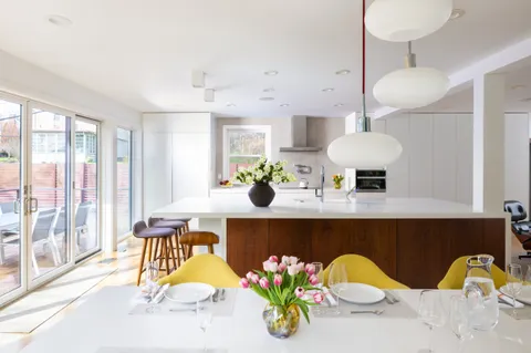 a view of dining room with furniture and chandelier