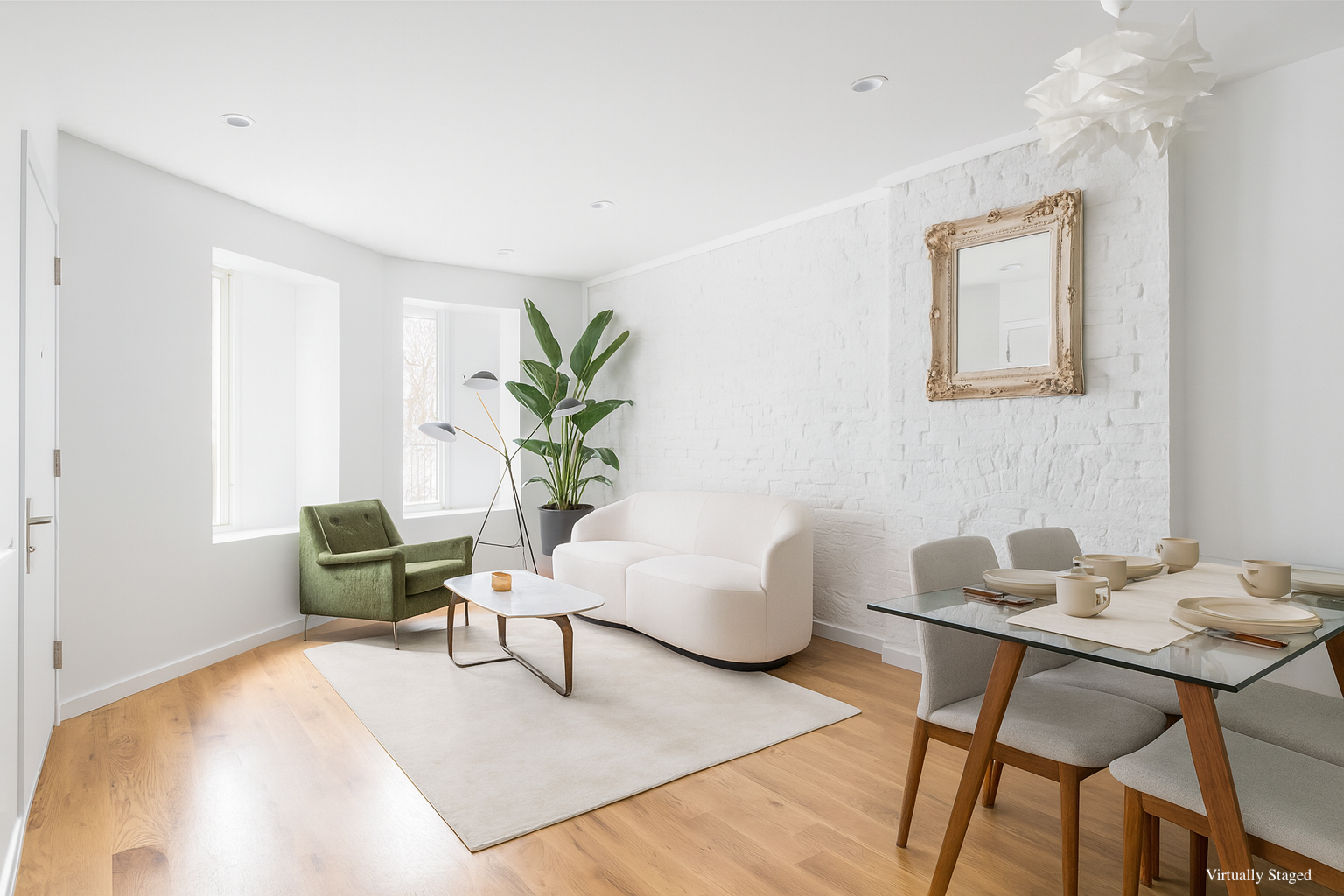 a living room with furniture and a potted plant