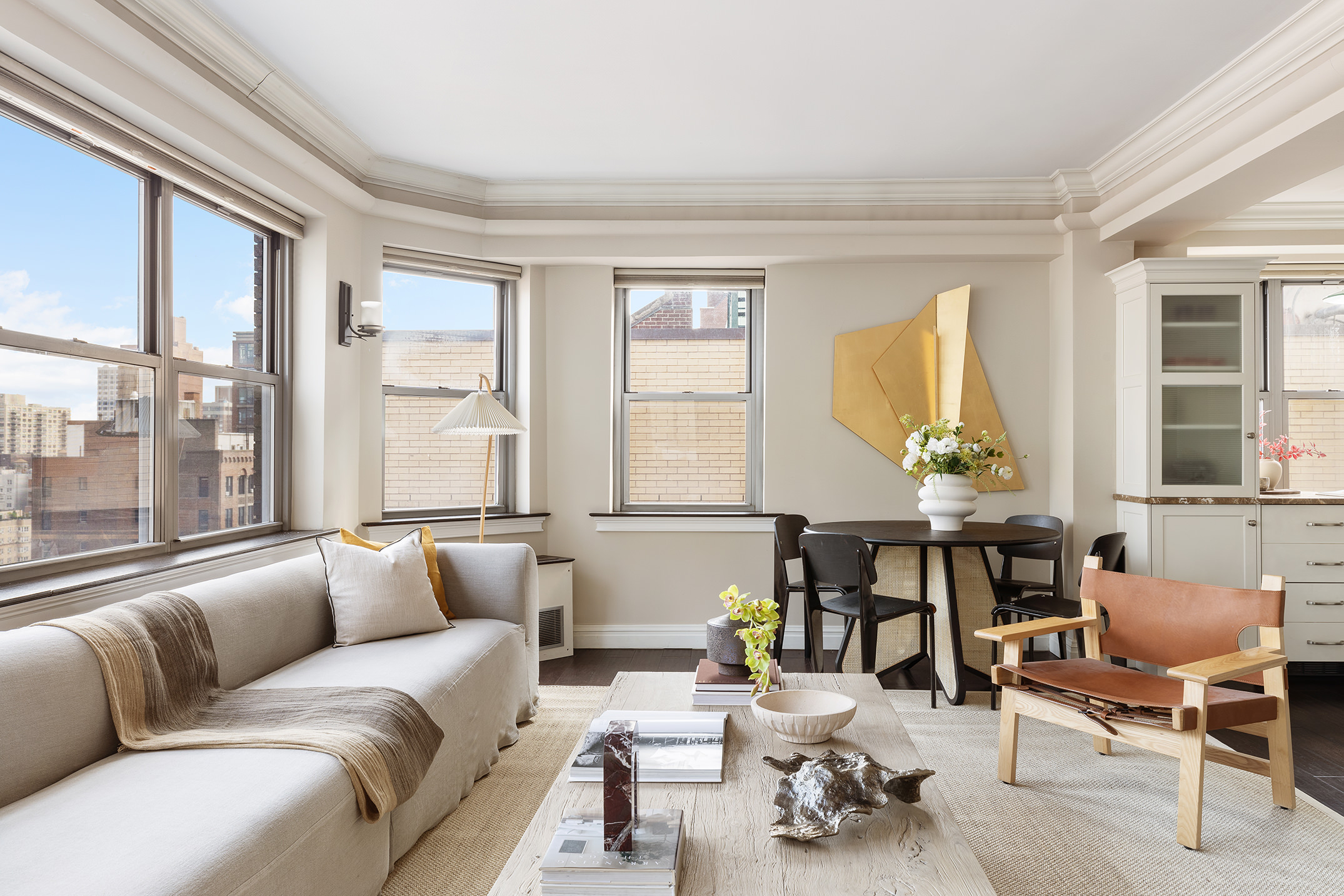 80 Park Avenue, Unit 19N Manhattan, NY 10016 - Photo 8 of 20 a living room filled with furniture and a large window