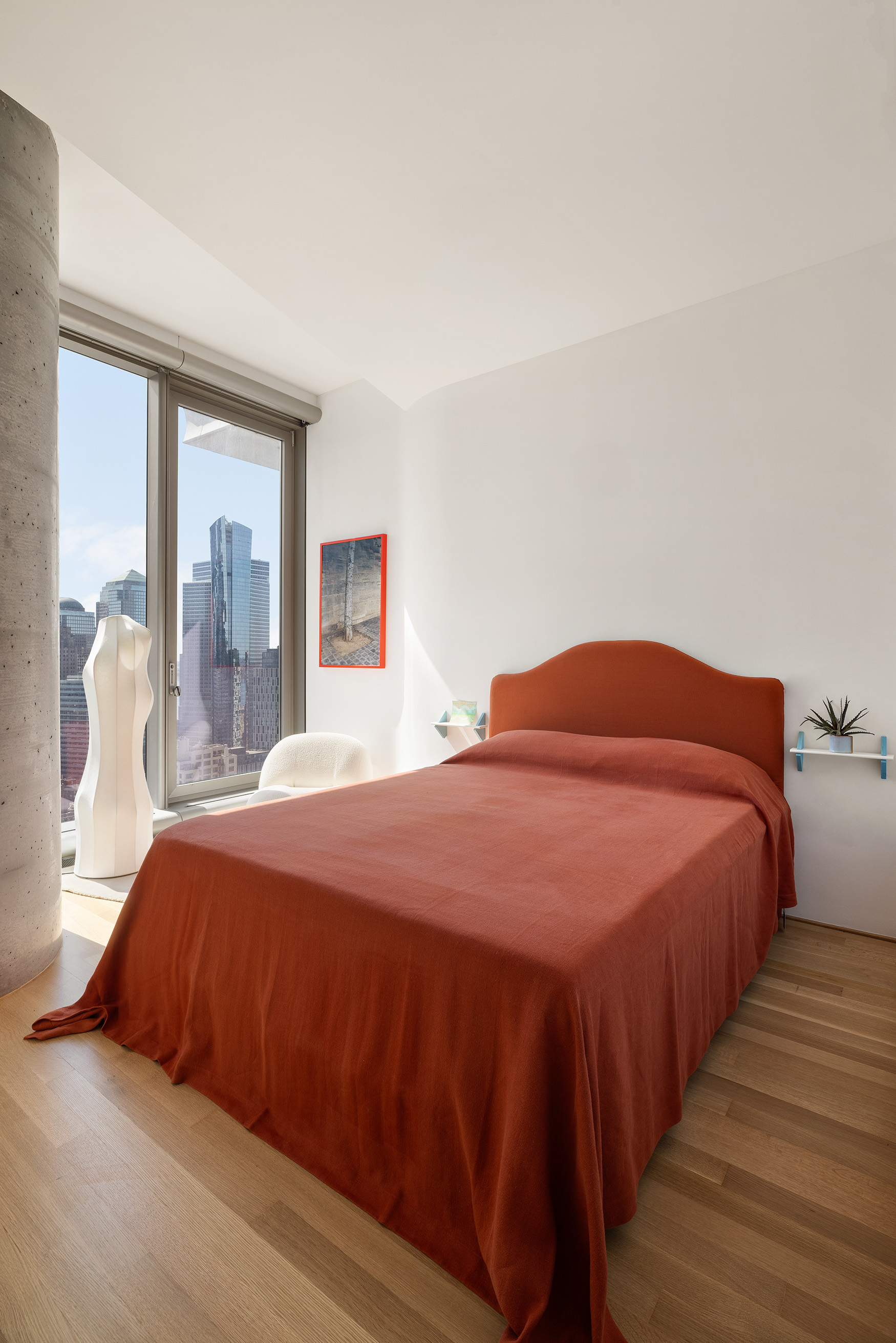 56 Leonard Street, Unit 33AWEST Manhattan, NY 10013 - Photo 8 of 12 a bedroom with a bed and wooden floor