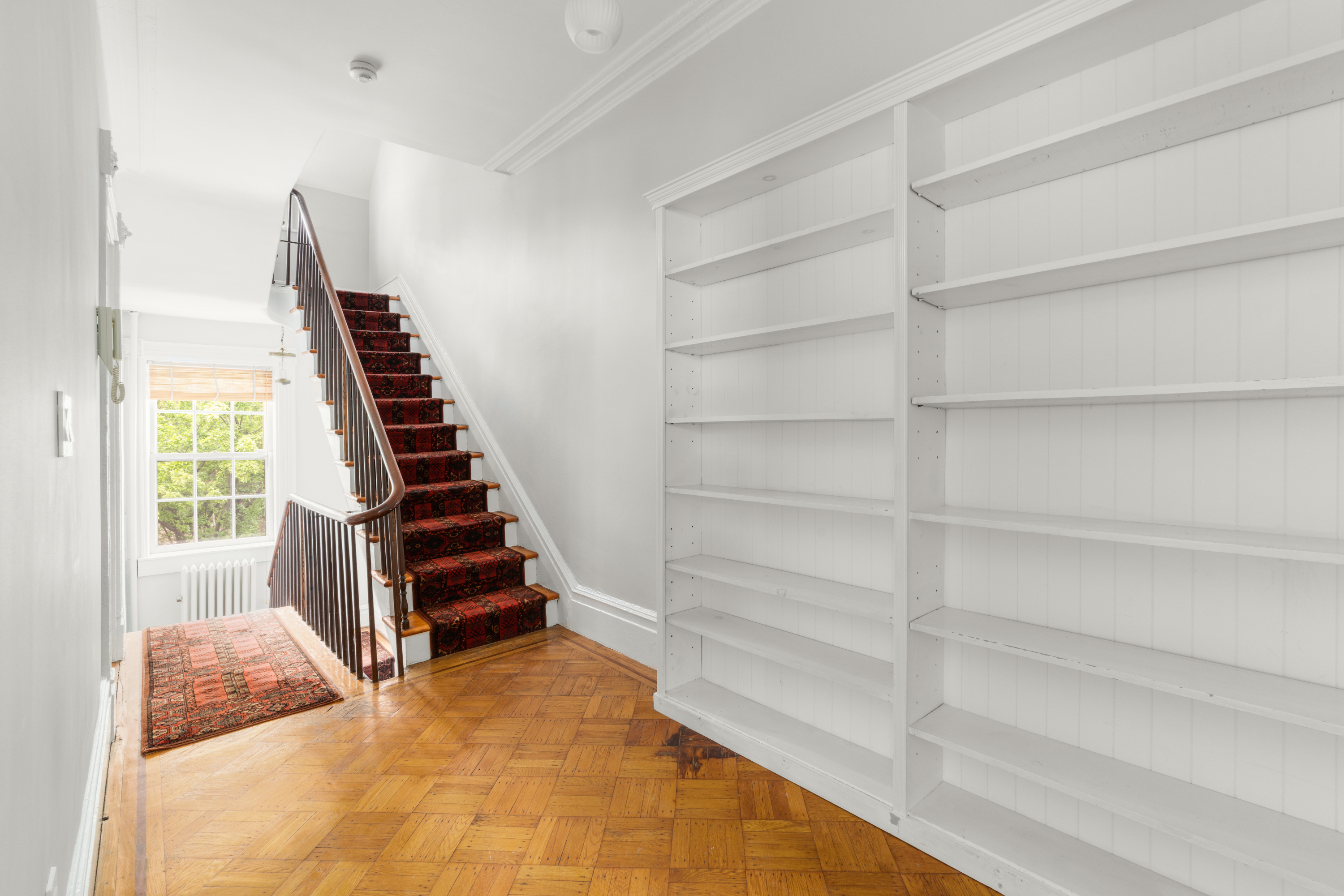 60 Hicks Street Brooklyn, NY 11201 - Photo 10 of 22 a view of room with stairs and wooden floor
