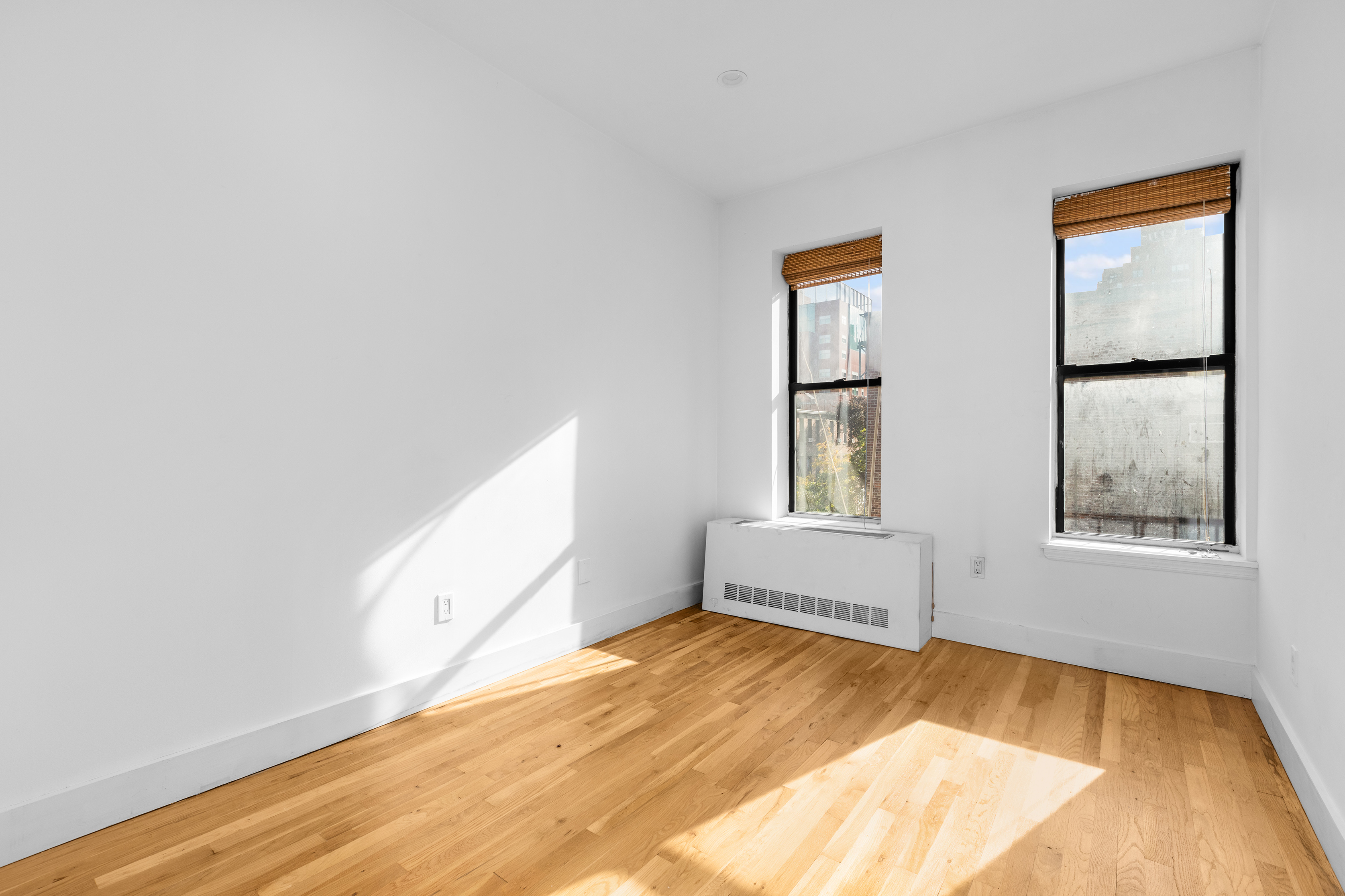 1582 York Avenue, Unit 5B Manhattan, NY 10028 - Photo 2 of 14 a view of an empty room and window