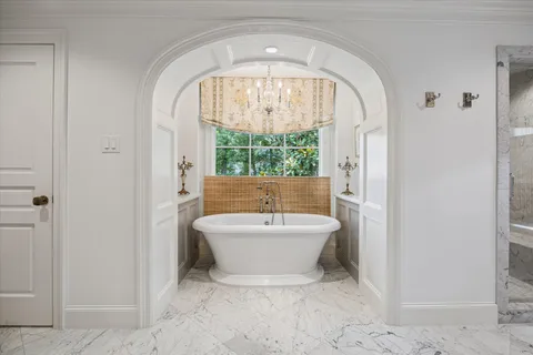 a bathroom with a granite countertop sink mirror and double