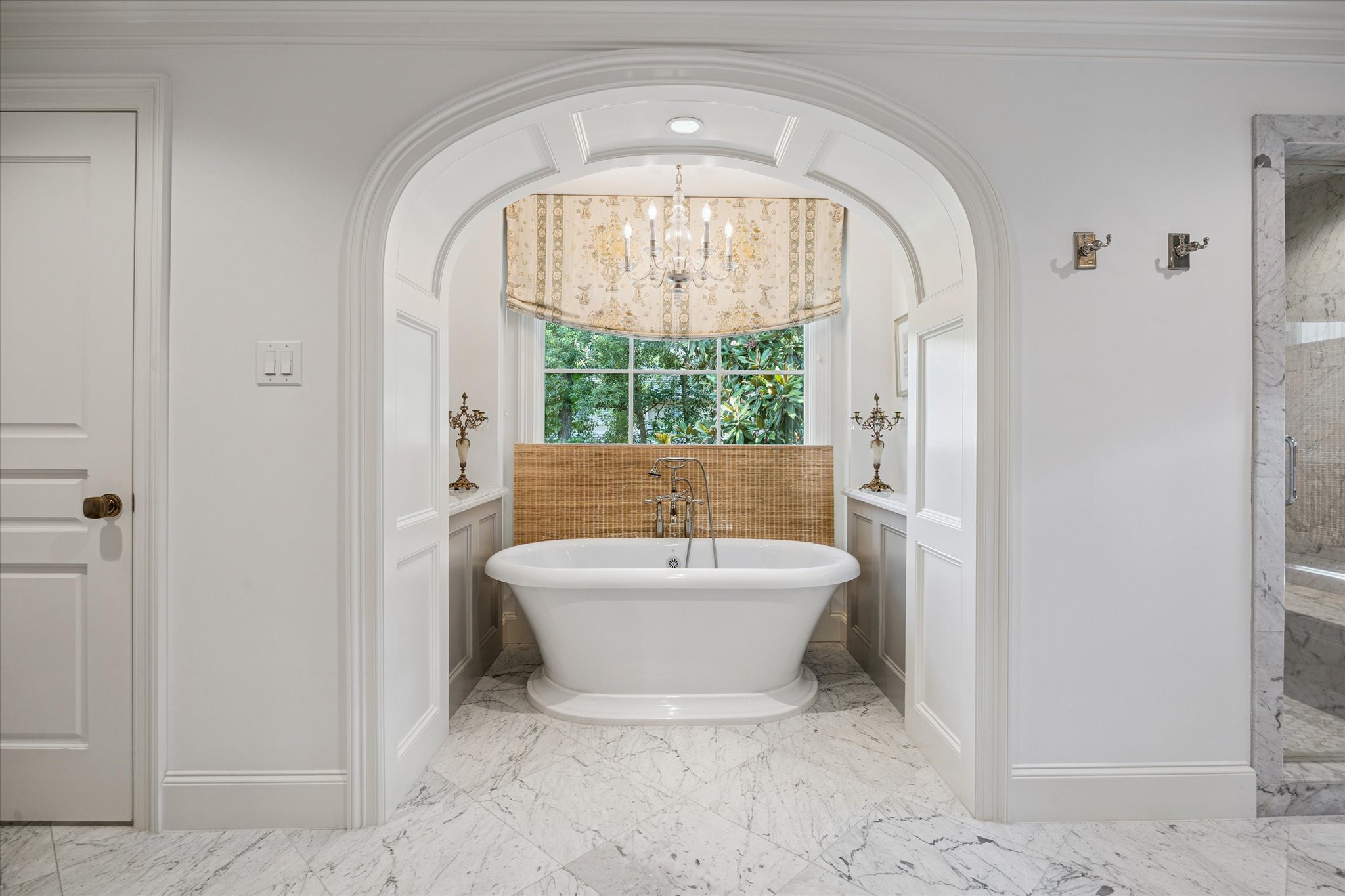 310 Longwoods Lane Houston, TX 77024 - Photo 29 of 49 a spacious bathroom with a bathtub and window
