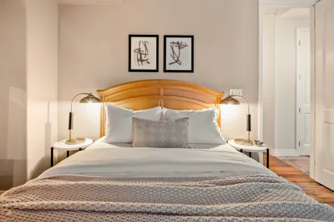 a bedroom with a bed and a table