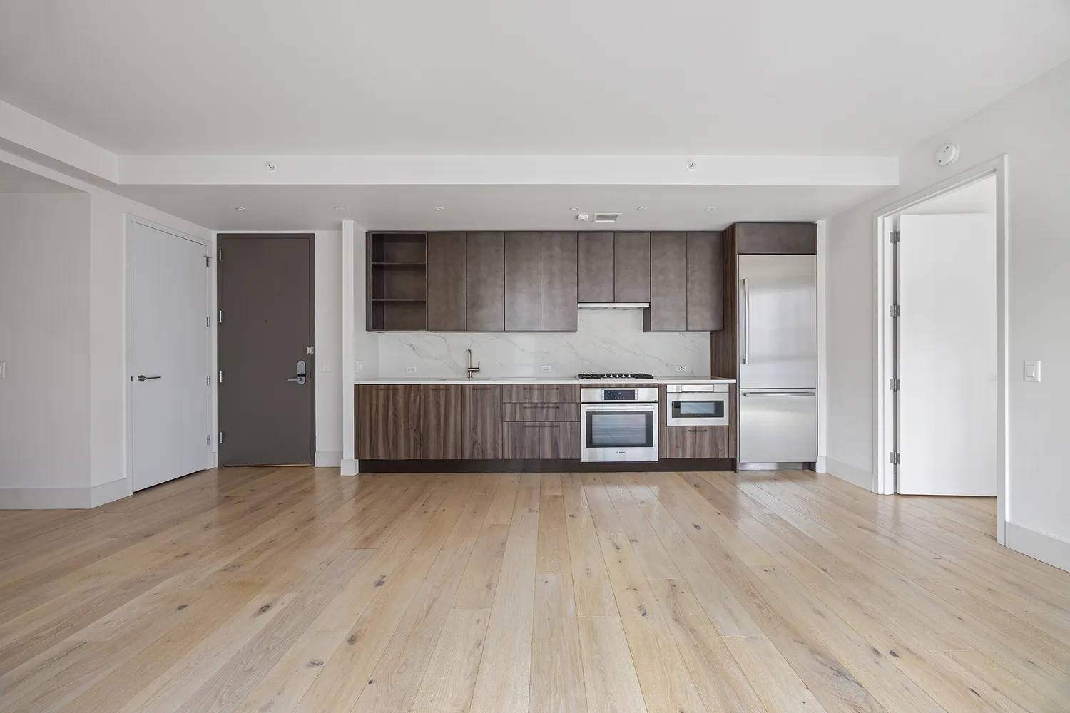 a kitchen with a stove and a refrigerator