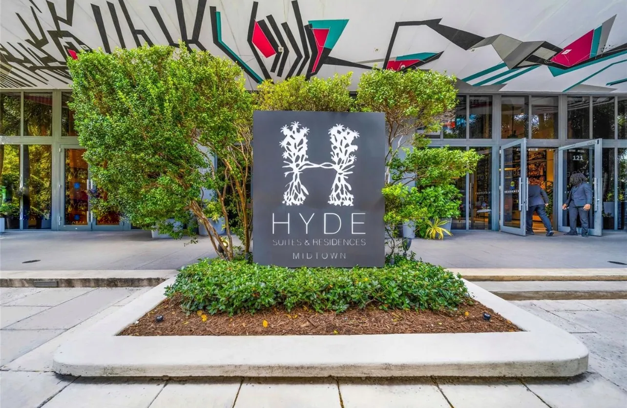 a front view of a building with garden