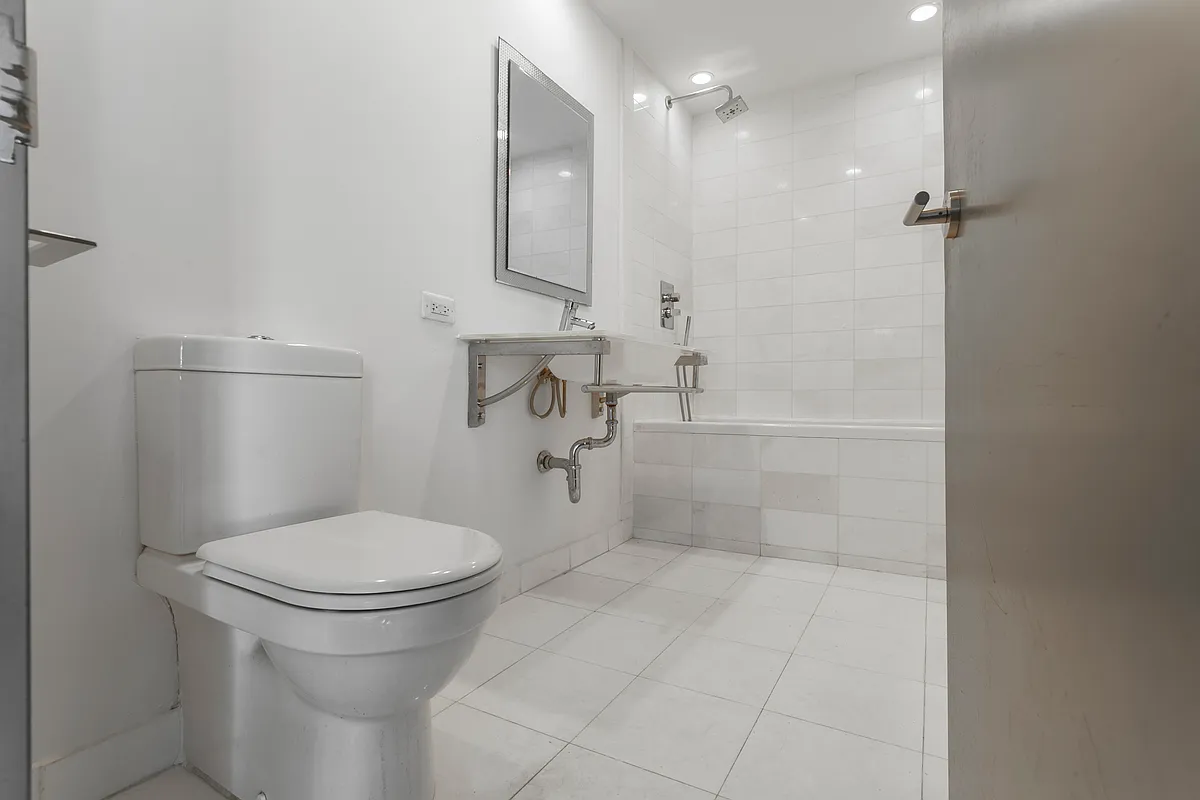 542 Saint Marks Avenue, Unit 101 Brooklyn, NY 11238 - Photo 5 of 5 a bathroom with a toilet and a shower