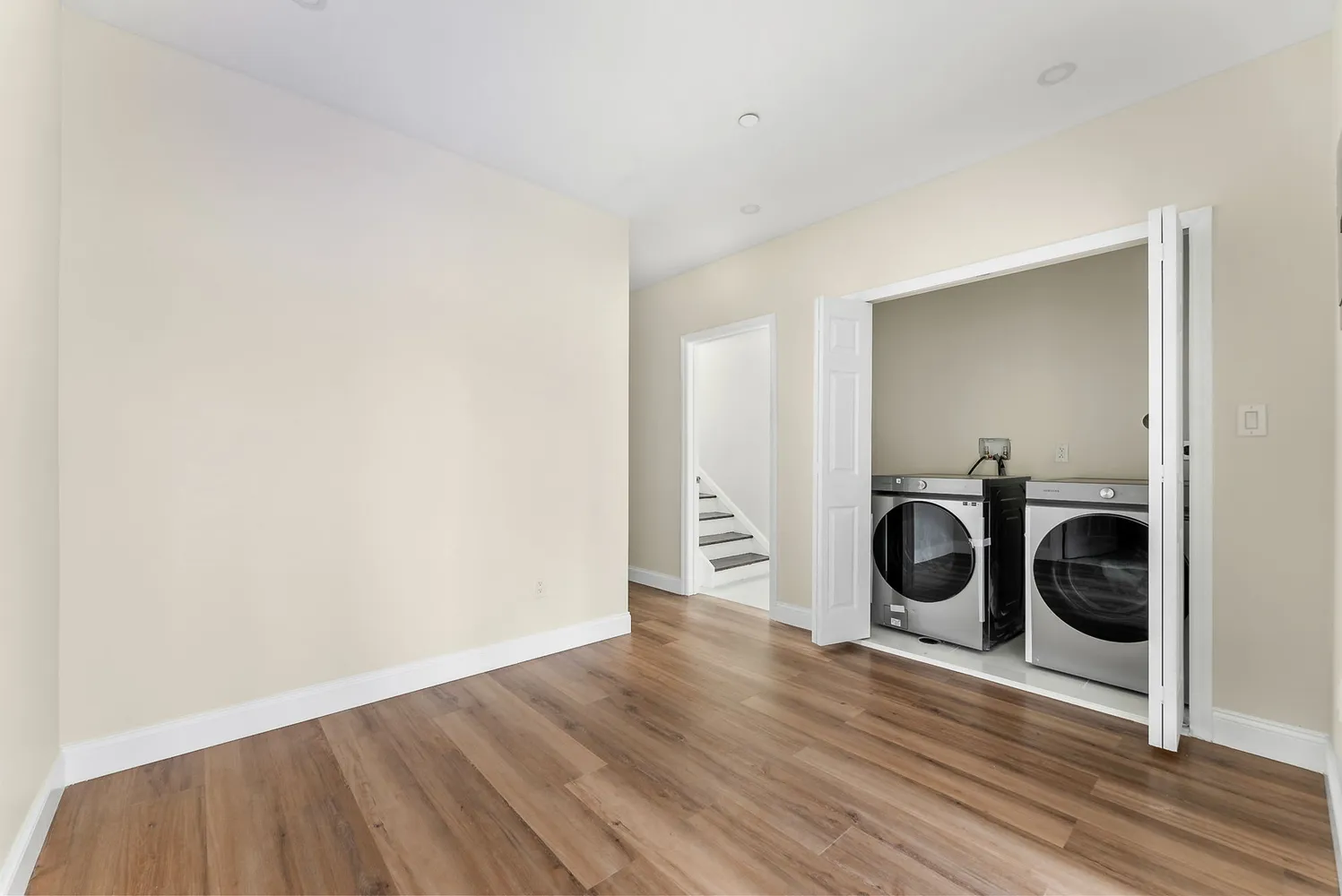 a view of a kitchen with a stove top oven