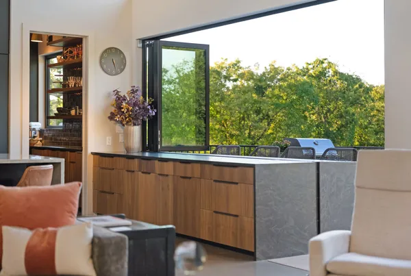 a living room with fireplace furniture and a large window