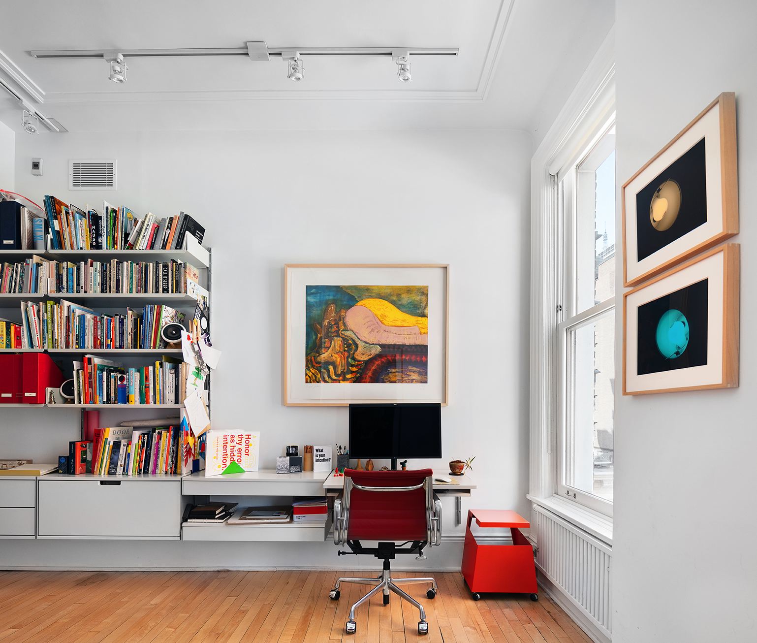 366 Broadway, Unit 8A Manhattan, NY 10013 - Photo 9 of 13 a workspace with furniture and book shelf