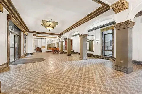 a view of a building with furniture
