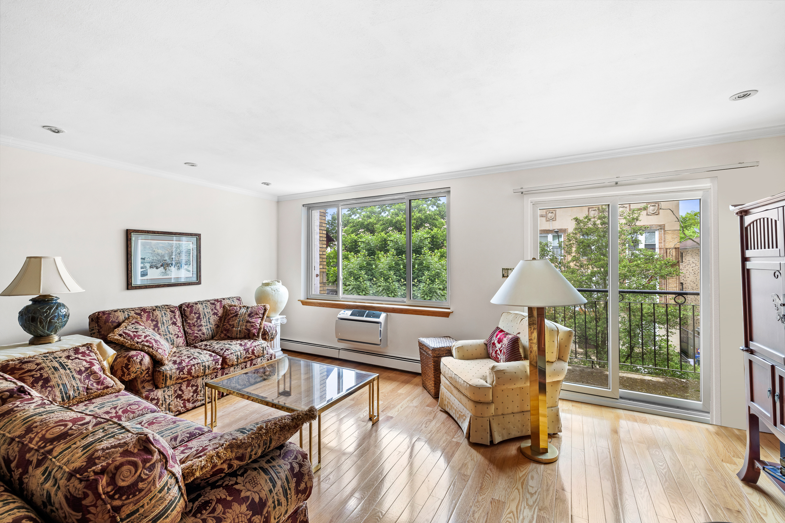 436 78th Street, Unit 5 Brooklyn, NY 11209 - Photo 3 of 10 a living room with furniture and a large window