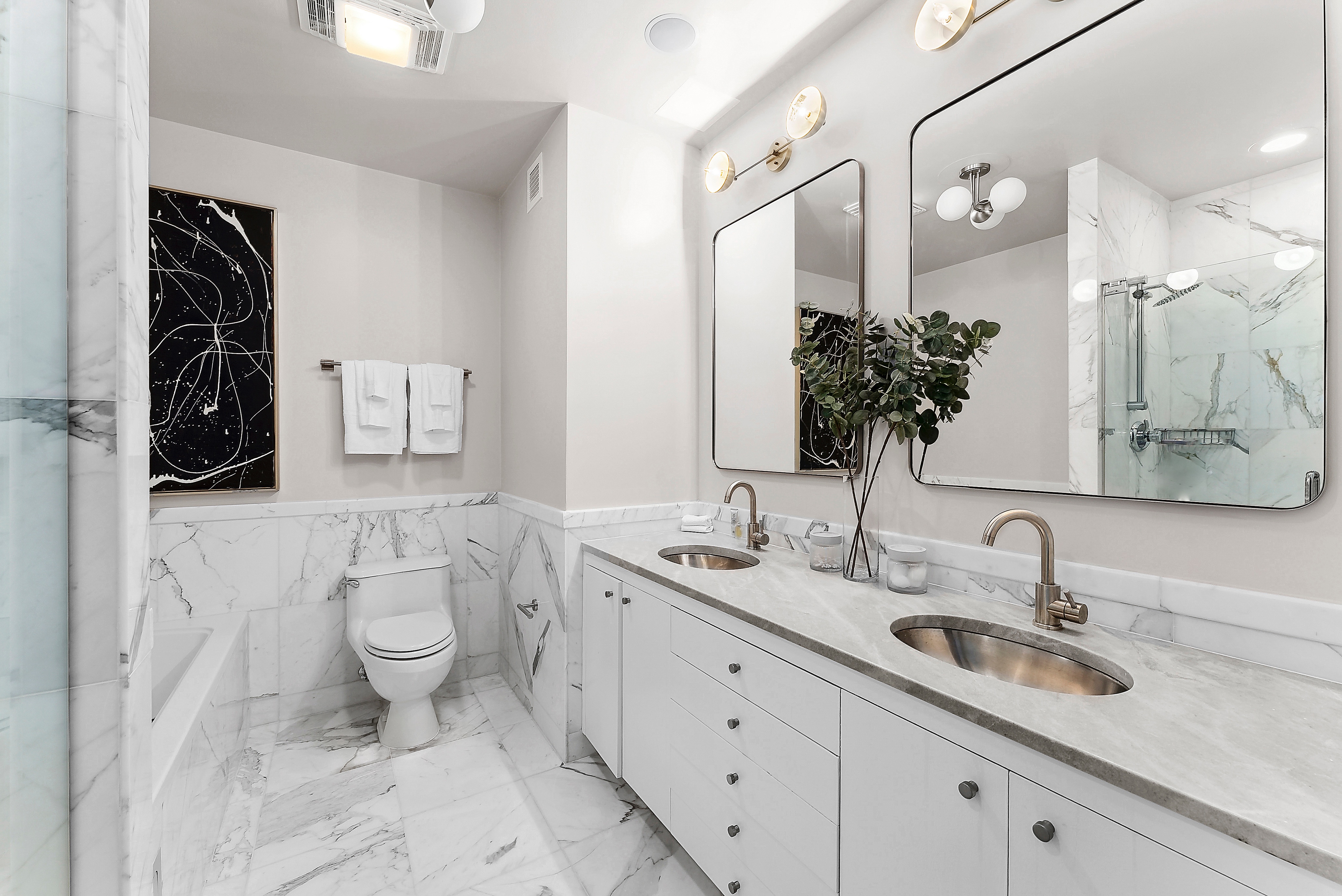 224 West 18th Street, Unit PHA Manhattan, NY 10011 - Photo 12 of 24 a bathroom with a toilet sink double vanity and mirror