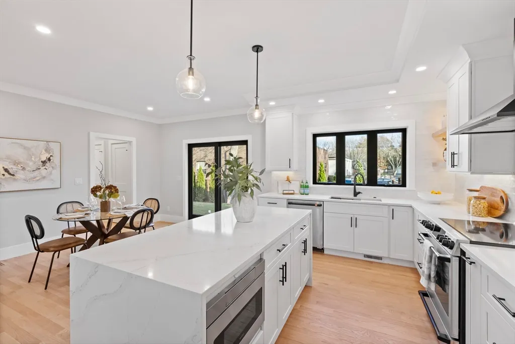 a large white kitchen with lots of counter space