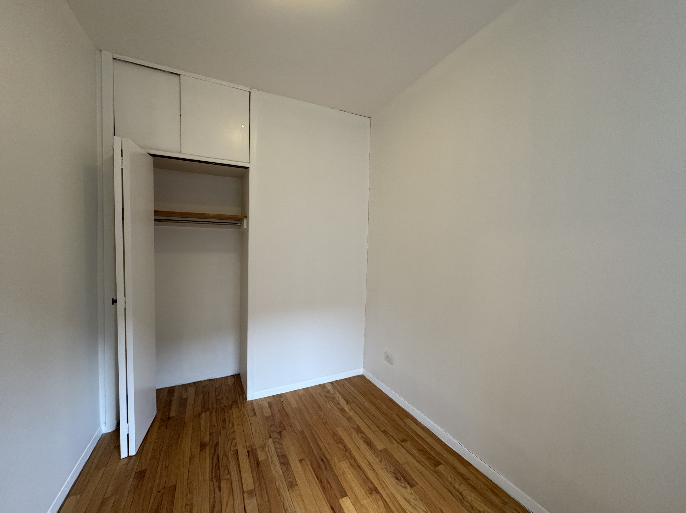 451 West 44th Street, Unit 63 Manhattan, NY 10036 - Photo 12 of 31 a view of a room with wooden floor