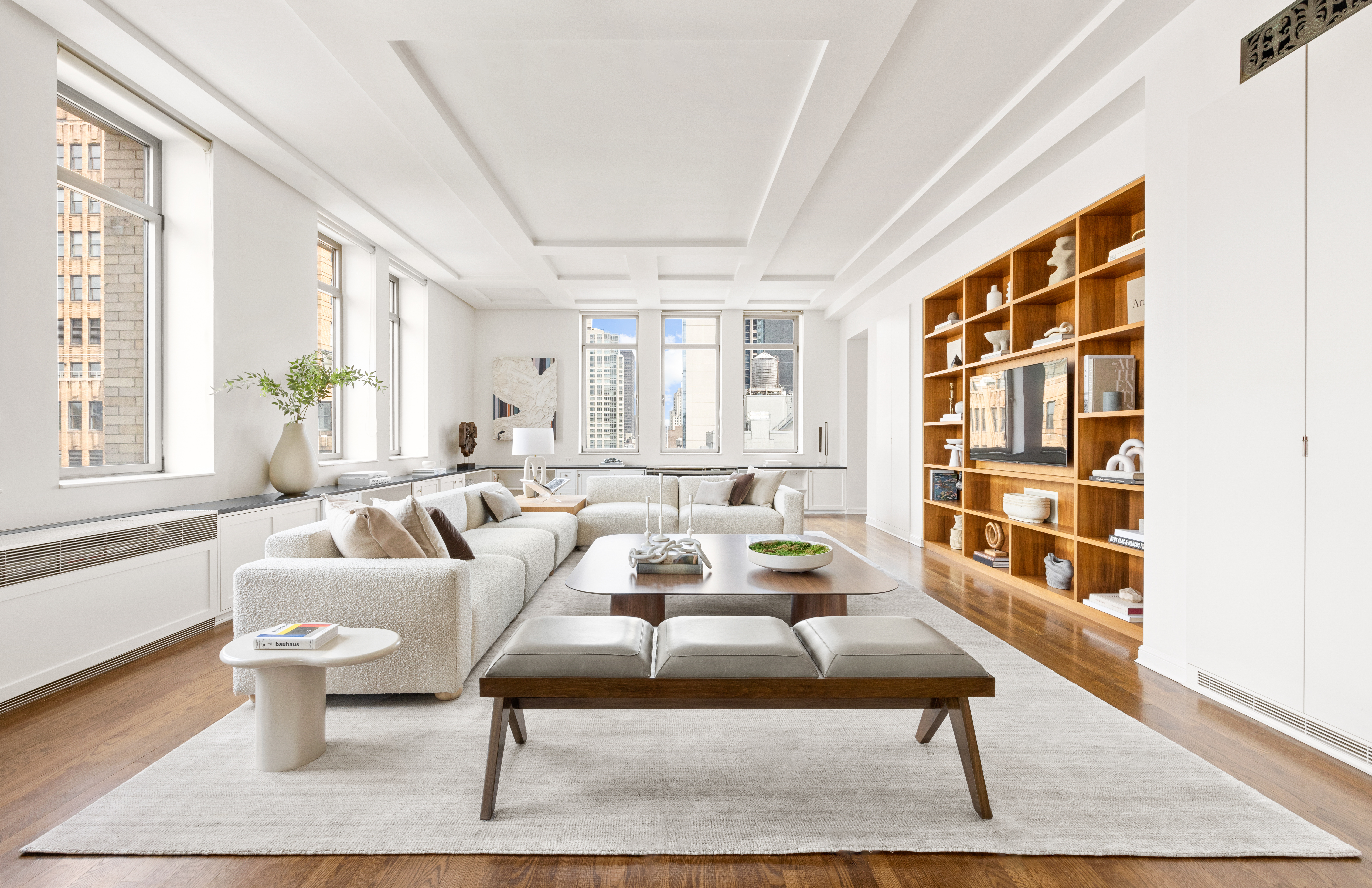 252 7th Avenue, Unit 17I Manhattan, NY 10001 - Photo 3 of 17 a living room with furniture and a table