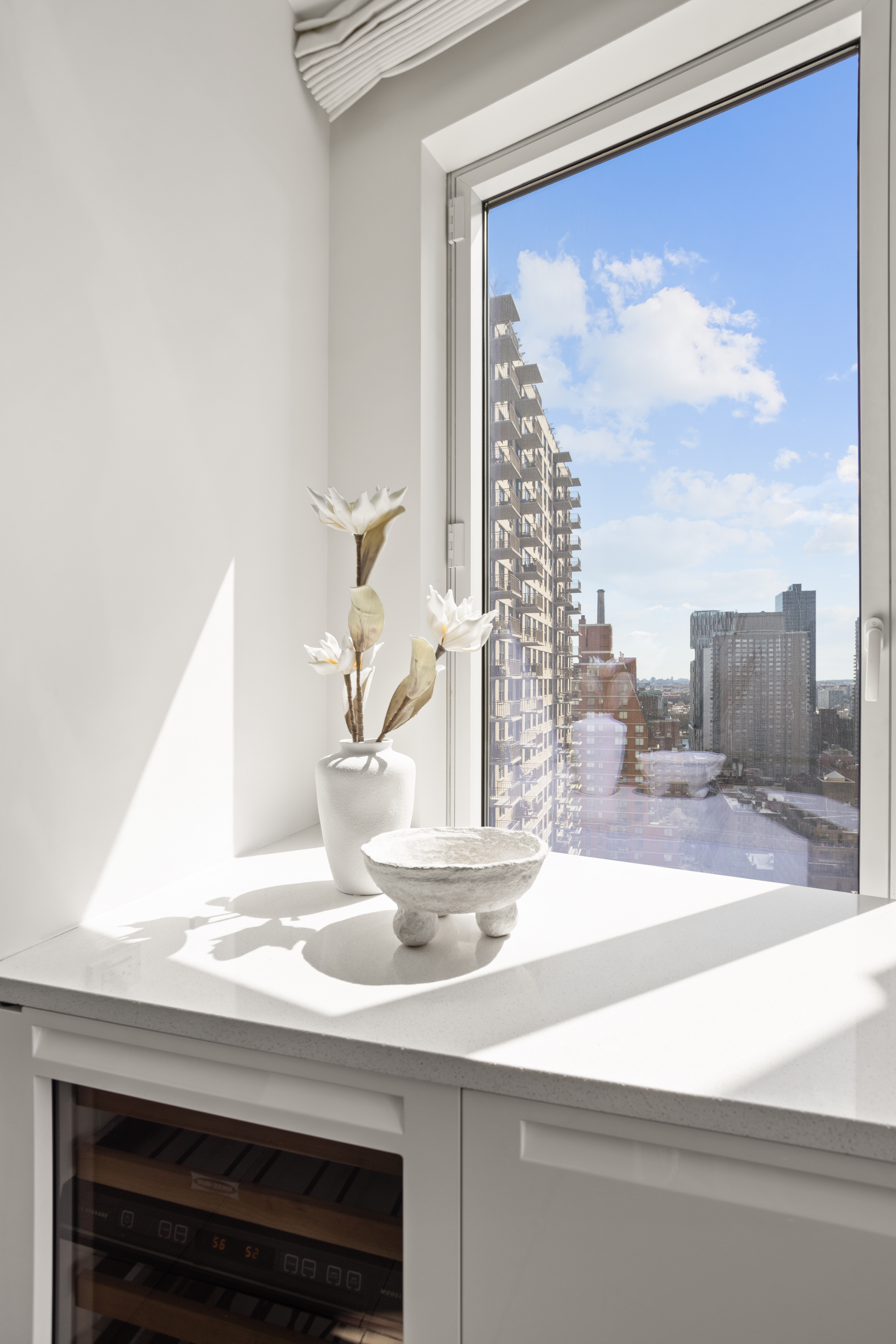 255 East 74th Street, Unit 21B Manhattan, NY 10021 - Photo 10 of 40 a bathroom with a sink and a mirror