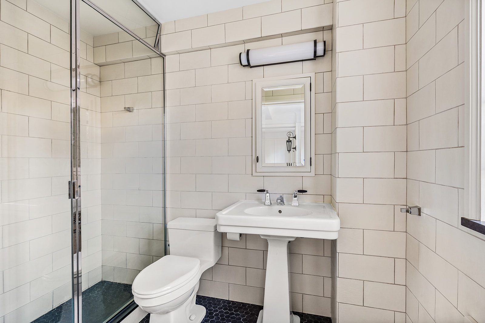 44 Gramercy Park North, Unit 8B Manhattan, NY 10010 - Photo 4 of 10 a bathroom with a sink toilet and shower