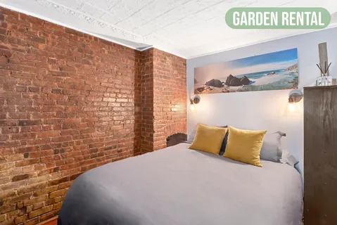 a bedroom with a bed and a table