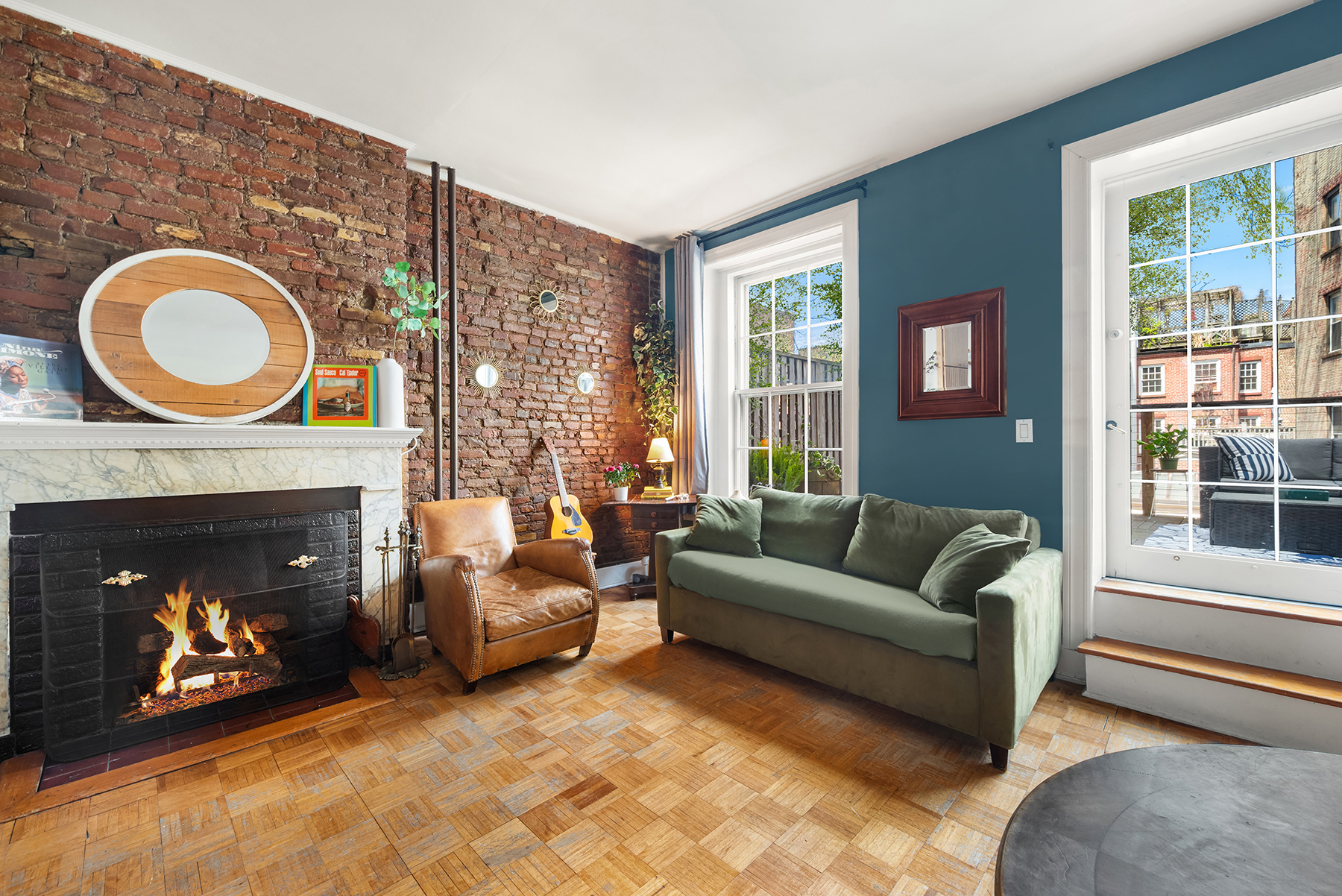 5 Charles Street, Unit 3R Manhattan, NY 10014 - Photo 3 of 14 a living room with furniture and a fireplace