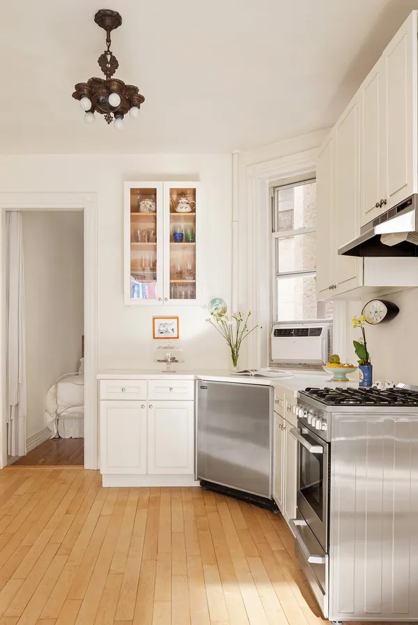 a kitchen with stainless steel appliances a sink stove and refrigerator