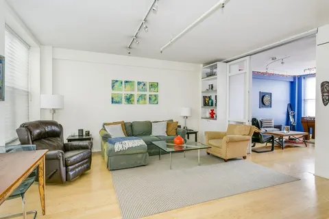 a living room with furniture and a window