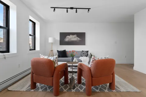 a living room with furniture and a window
