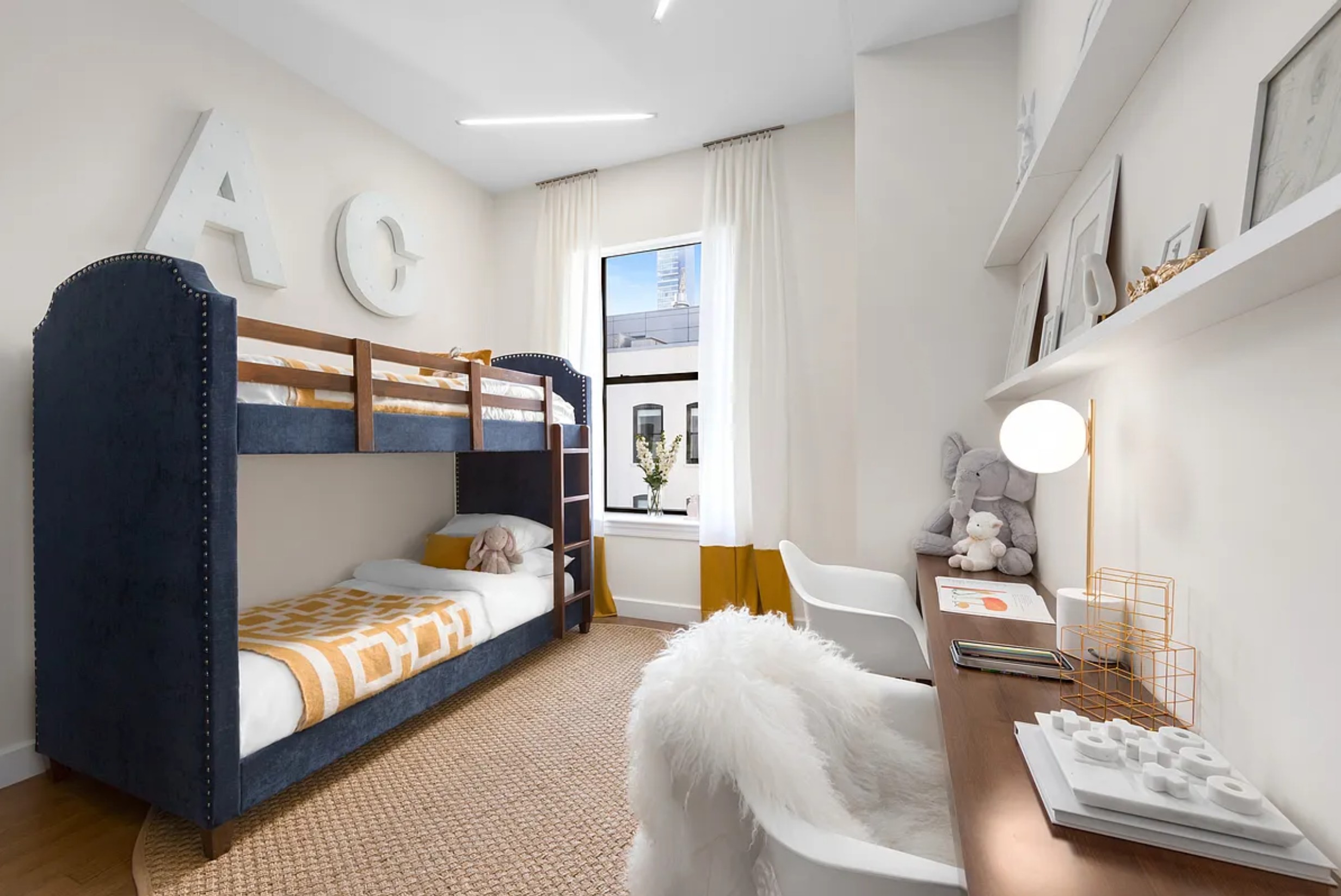 225 5th Avenue, Unit PHY Manhattan, NY 10010 - Photo 9 of 10 a bedroom with furniture and a wooden floor