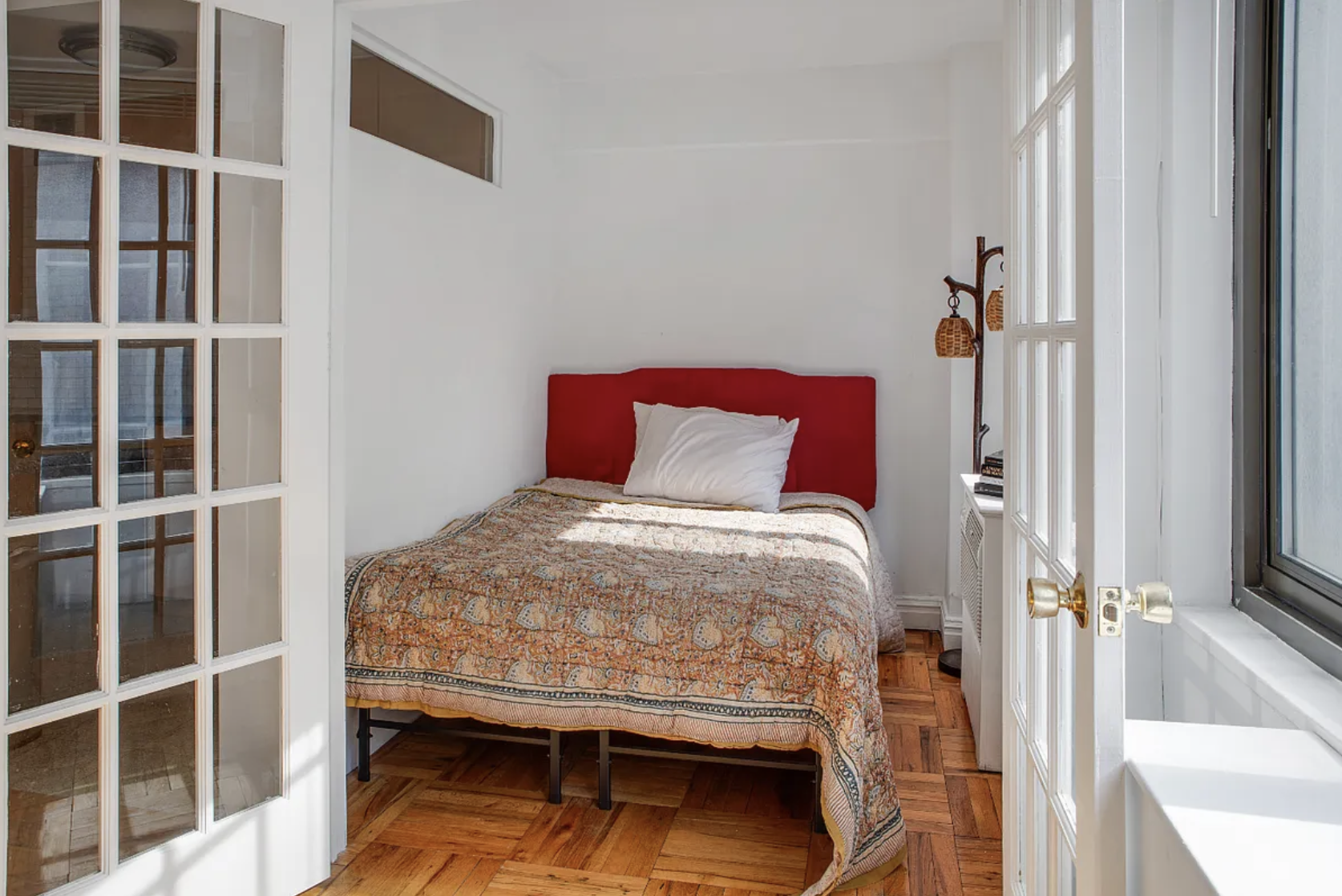 420 East 64th Street, Unit E7K Manhattan, NY 10065 - Photo 5 of 10 a bedroom with a bed and a window
