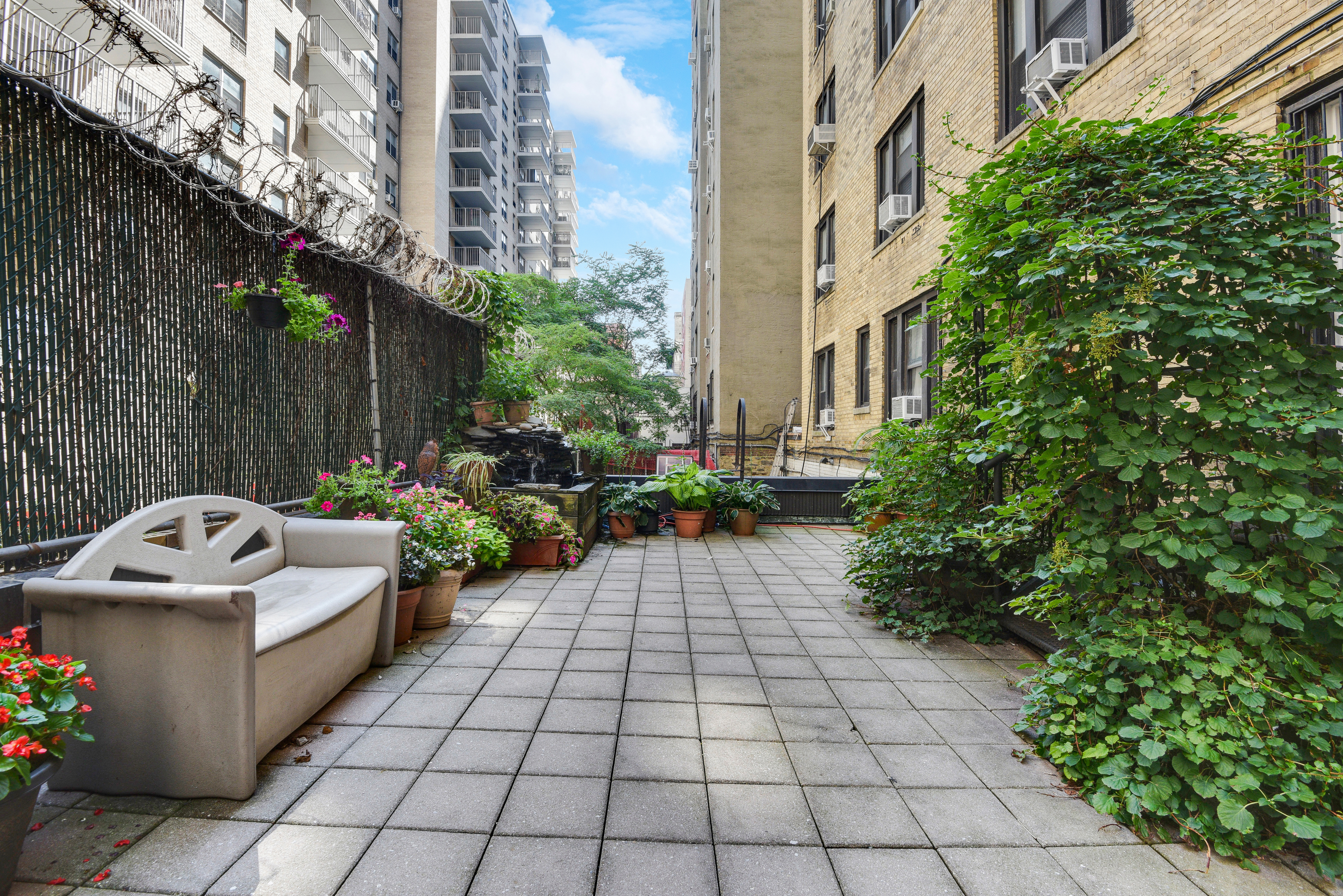 41 West 96th Street, Unit 1B Manhattan, NY 10025 - Photo 6 of 24 a view of a yard with chairs in a patio
